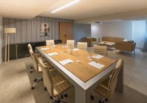 a conference room with a large table and chairs at Elinotel Sermilia Resort in Psakoudia +73 photos