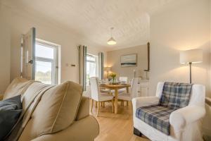 a living room with a couch and a table at 2 Bed in Bishopston oc-h28996 in Bishopston