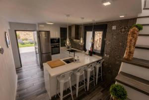 a kitchen with a kitchen island with a sink at Comeback el Rinconcito de Guajar in Guájar-Faragüit
