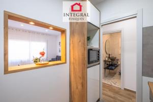 a view of the entrance to a living room with a window at Apartament Marea Baixa in Palamós