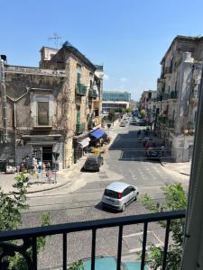 a view from a balcony of a street with a car at Appartamento Annurca in Naples