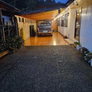 a car parked in a garage with a car parked in it at Espacio Calma in Valdivia