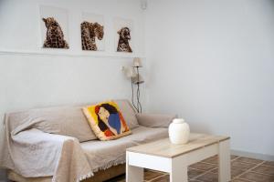 a living room with a couch and a table at Bungalow and private XXL Terrace in Alicante