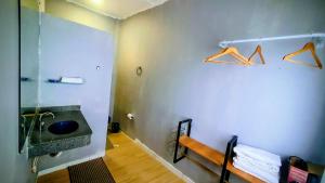 a bathroom with a sink and a mirror at Ap Umarizal l WiFi 500MB in Belém +24 photos