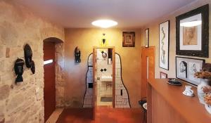 a hallway with a room with a staircase in a house at VISTA ART sea view in Funtana +23 photos