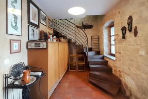 a hallway with a spiral staircase in a house at VISTA ART sea view in Funtana