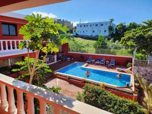 a view of a swimming pool from a balcony at Villa KIKI Ensenada in Punta Rucia