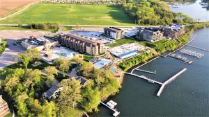 an aerial view of a building next to a lake at Bridges Bay Vacation Cabin 69 in Arnolds Park