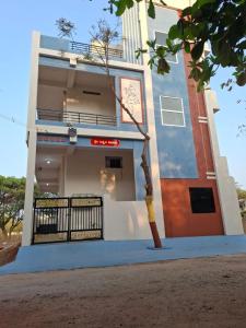 a building with a gate in front of it at Lotus Villa Hampi in Hospet