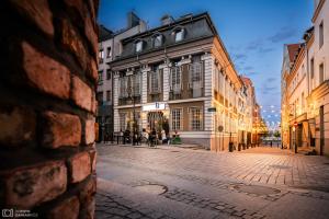 an empty street in a city with buildings at Cocorico Bed and Breakfast OLD TOWN Szczecin Adults Only in Szczecin
