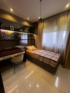 a bedroom with a bed and a desk at Serenity Residens Two bedrooms in Alanya +34 photos