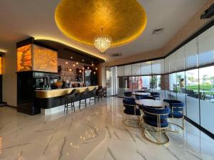 a bar in a restaurant with a large gold ceiling at Serenity Residens Two bedrooms in Alanya