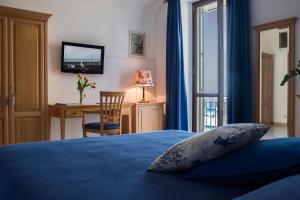Postel nebo postele na pokoji v ubytování B&B L'Approdo
