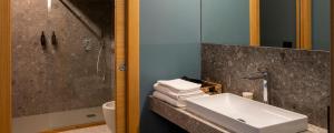 a bathroom with a sink and a glass shower at Chambre d'Hotes Vista Monte Bianco in La Salle +16 photos