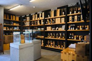 a store filled with lots of bottles of wine at Quinta do Vallado - Douro Wine Hotel in Peso da Régua