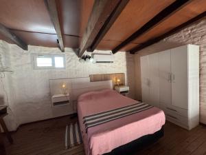 a bedroom with a large bed in a room at Patagonia Faro Norte Lighthouse in Carmen de Patagones