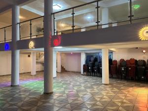 a room with a bunch of chairs in a building at TOU R serjo polo in Douala