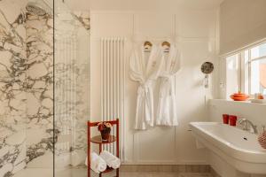 a bathroom with a shower and a sink at Hotel Villa Bonnie in Knokke-Heist +78 photos
