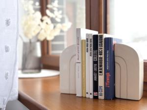 a row of books sitting on a table at V Talutě in Chyšky