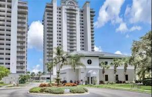 a building in front of two tall buildings at Blue Heron Resort in Orlando