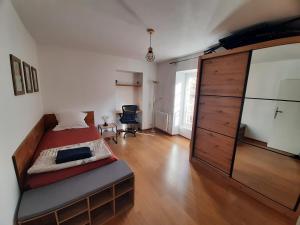 a bedroom with a bed and a large dresser at Ecrin de Valdeblore in Valdeblore