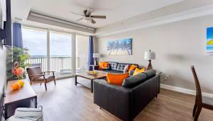 a living room with a couch and a table at Blue Heron Resort in Orlando