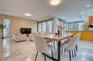 a dining room with a table and chairs at DownTown Villa 2 in Paphos