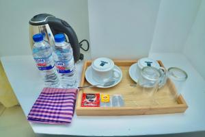a tray with two bottles of water on a table at TENBY Guest House in Anuradhapura