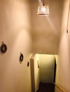 a room with a hallway with a door and a light at Hotel Boutique 1970 in Asunción