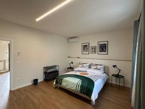 a bedroom with a bed and a fireplace in it at B&b DALLA FE in Fermignano