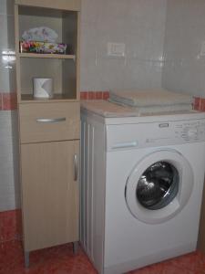 a washer and dryer in a room at Sirolo Summer Appartamento in Sirolo +3 photos