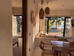 a living room with a couch and a table at Aldea Cayaco Villa A1 in La Manzanilla