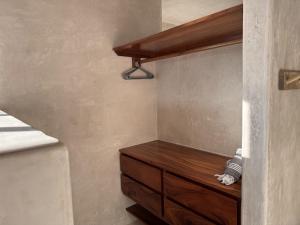 a bedroom with a wooden dresser in a room at Aldea Cayaco Villa A1 in La Manzanilla +22 photos