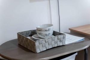 a tray with a bowl and plates on a table at Ben View Room and Jacuzzi Bath in Fort William