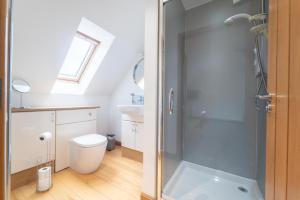 a bathroom with a shower and a toilet at Ben View Room 4 in Fort William