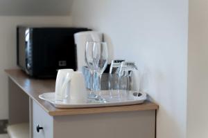 a counter with wine glasses and a toaster on it at Ben View Room 4 in Fort William +5 photos