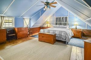 a bedroom with a bed and a ceiling fan at Candlewood Isle in New Fairfield +42 photos