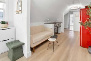 a living room with a couch and a table at Harbor Haven, Apt #4 - 2BR/1BA in Stamford