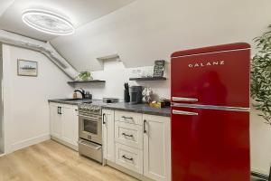 a kitchen with a red refrigerator in a room at Harbor Haven, Apt #4 - 2BR/1BA in Stamford +25 photos