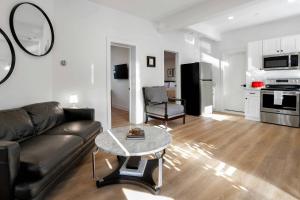 a living room with a couch and a table at Harbor Haven, Apt #5, 3BR/2BA in Stamford