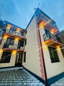 a building with lights on the side of it at City Star Kutaisi in Kutaisi