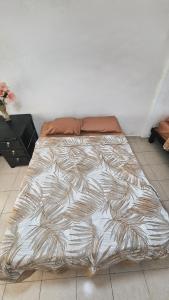 a large bed sitting in a room with at Casa Amplia San Pedro Norte Cerca Fco Montejo in Mérida