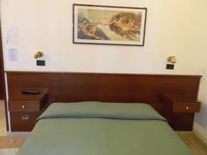 Postel nebo postele na pokoji v ubytování Hotel Primavera