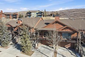 an aerial view of a home with a mountain in the background at Snowline at Black Rock Ridge in Kamas