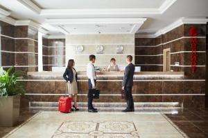 a group of people standing in a lobby at Spa Hotel Meliot in Chelyabinsk