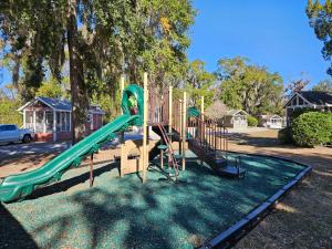 a playground with a slide in a park at Live Oak Landing in Freeport