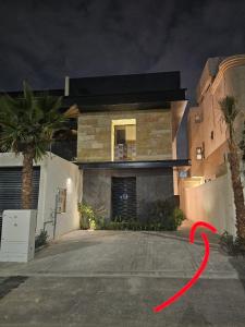 a house with a red ribbon in front of it at شقق باطلالات بانوراميه in Riyadh