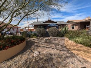 a home with a driveway in front of a house at Casa 131 in Tucson