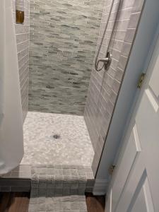 a bathroom with a shower with a drain at Casa 131 in Tucson +12 photos