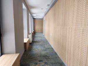 a corridor of a hospital with a long hallway at MIK Hotel Korça in Korçë +24 photos